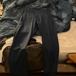 Mens underarmour 30x32 navy blue golf pants, moisture wicking. Never worn.